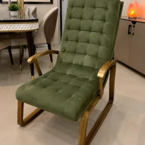 green tufted lounge chair with curved wooden armrests and sled base